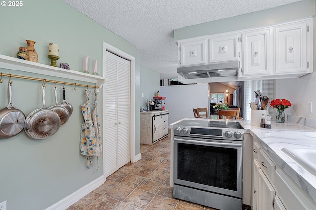 1354 Mulligan Ct, Salem, OR 97306 - kitchen featuring electric range, under cabinet range hood, white cabinets, baseboards, and a textured ceiling