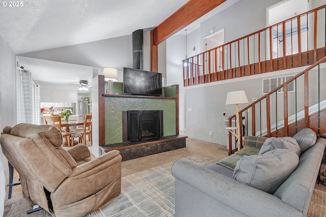 1354 Mulligan Ct, Salem, OR 97306 - carpeted living area featuring ceiling fan, stairway, a high end fireplace, a textured ceiling, and high vaulted ceiling