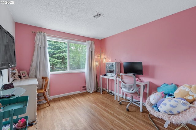 1354 Mulligan Ct, Salem, OR 97306 - office space with wood finished floors, a textured ceiling, and baseboards