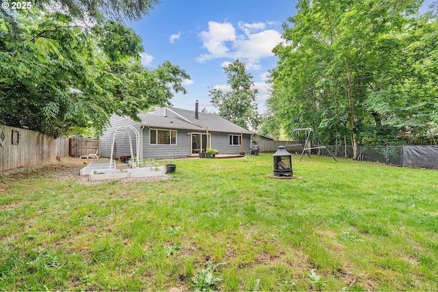 1354 Mulligan Ct, Salem, OR 97306 - rear view of property featuring a fire pit and a patio area