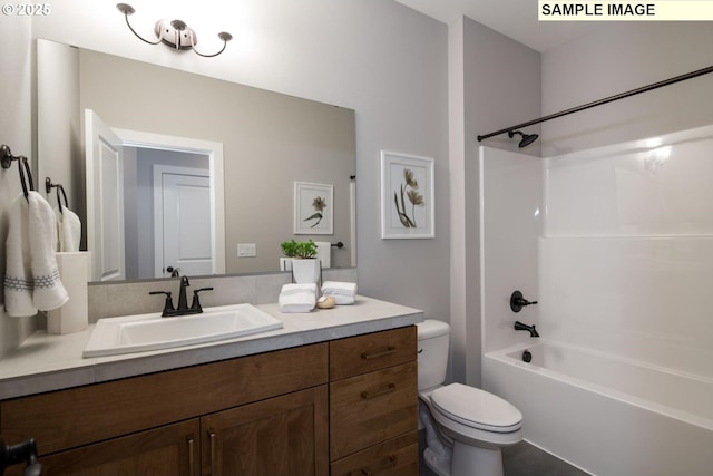 bathroom featuring shower / washtub combination, vanity, and toilet