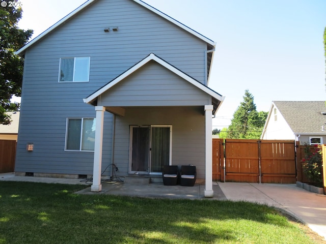 439 NW Garibaldi St, Hillsboro, OR 97124 - rear view of property featuring a gate and a patio