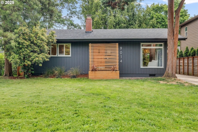9014 N John Ave, Portland, OR 97203 - view of front facade with a chimney, a front lawn, and a shingled roof