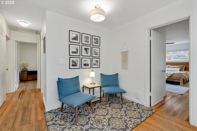 9014 N John Ave, Portland, OR 97203 - sitting room featuring attic access, light wood-style flooring, and baseboards