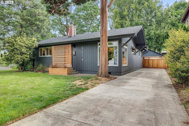9014 N John Ave, Portland, OR 97203 - view of front of property featuring a chimney, concrete driveway, and a shingled roof