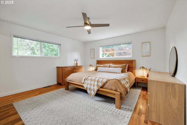 9014 N John Ave, Portland, OR 97203 - bedroom featuring multiple windows, light wood-type flooring, and a ceiling fan