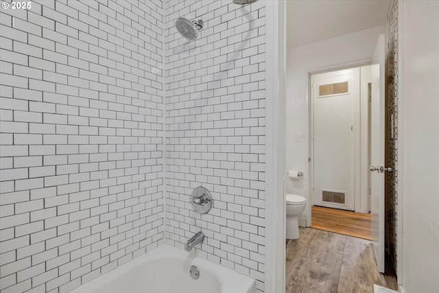 9014 N John Ave, Portland, OR 97203 - full bath featuring wood finished floors, toilet, and shower / bath combination