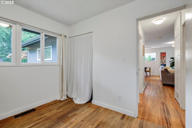9014 N John Ave, Portland, OR 97203 - bedroom with light wood-style floors and baseboards