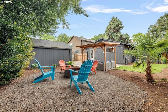 9014 N John Ave, Portland, OR 97203 - view of yard with an outdoor fire pit and an outbuilding