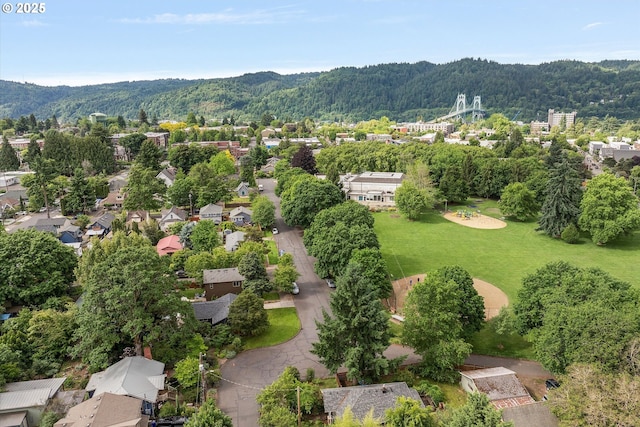 9014 N John Ave, Portland, OR 97203 - aerial view of residential area featuring a forest and a mountain backdrop