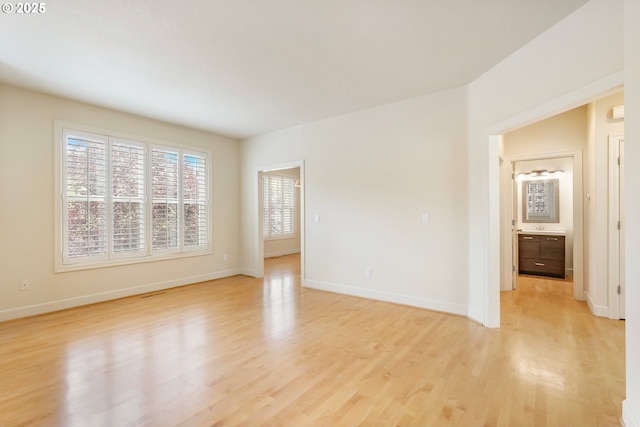 2435 NW Burnett St, Portland, OR 97229 - empty room featuring light wood-type flooring and baseboards