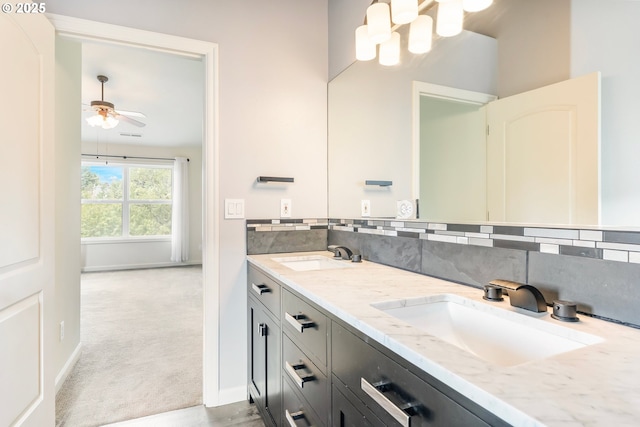 2435 NW Burnett St, Portland, OR 97229 - full bathroom with double vanity, tasteful backsplash, and ceiling fan