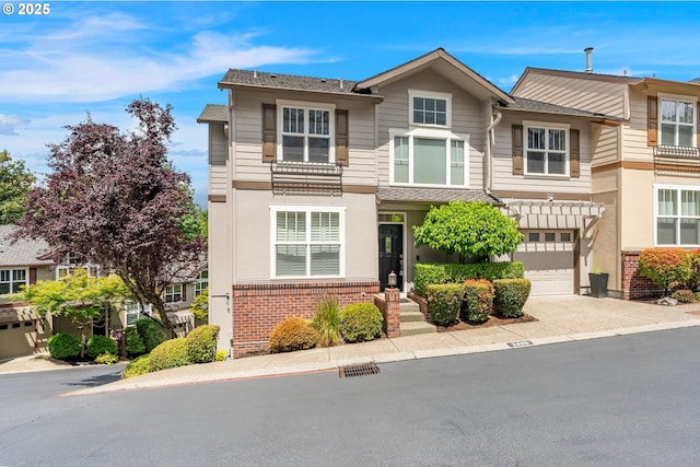 2435 NW Burnett St, Portland, OR 97229 - townhome / multi-family property with brick siding, driveway, and an attached garage