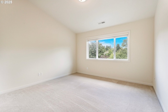 2435 NW Burnett St, Portland, OR 97229 - empty room featuring light carpet and vaulted ceiling