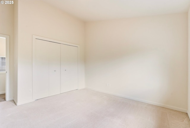 2435 NW Burnett St, Portland, OR 97229 - unfurnished bedroom featuring light carpet and a closet