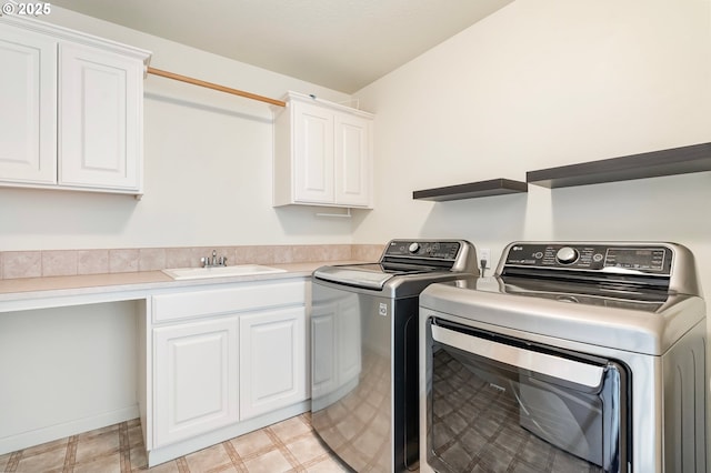 2435 NW Burnett St, Portland, OR 97229 - laundry room featuring separate washer and dryer, cabinet space, and light flooring