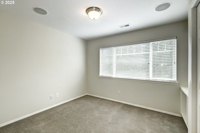 555 NE Caden Ave, Hillsboro, OR 97124 - carpeted empty room featuring healthy amount of natural light and baseboards