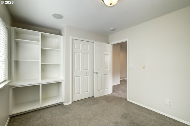 555 NE Caden Ave, Hillsboro, OR 97124 - unfurnished bedroom featuring carpet, multiple windows, a closet, and baseboards