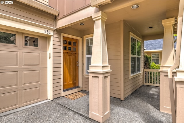 555 NE Caden Ave, Hillsboro, OR 97124 - entrance to property with covered porch, a garage, and board and batten siding