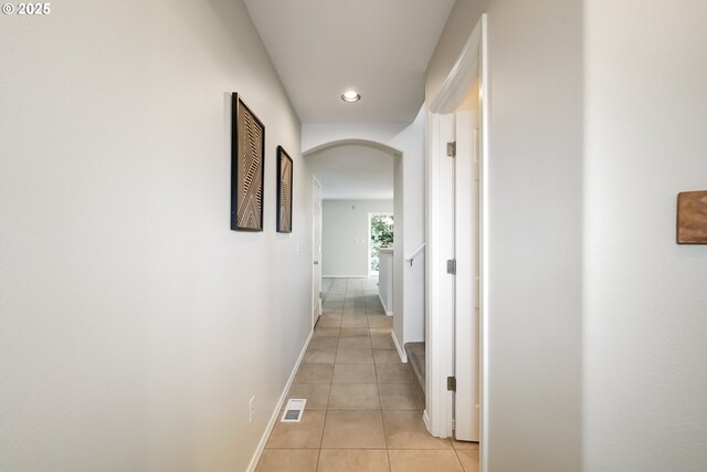 555 NE Caden Ave, Hillsboro, OR 97124 - corridor featuring arched walkways, light tile patterned flooring, recessed lighting, and baseboards