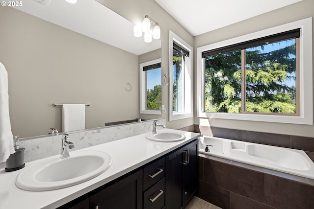7886 SW Capitol Hill Rd, Portland, OR 97219 - bathroom featuring healthy amount of natural light, a bath, and double vanity