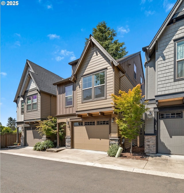 7886 SW Capitol Hill Rd, Portland, OR 97219 - view of front facade featuring stone siding, an attached garage, and board and batten siding