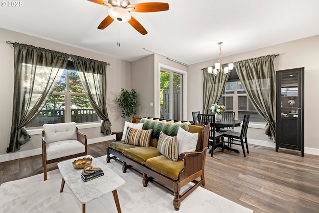 7886 SW Capitol Hill Rd, Portland, OR 97219 - living area with a chandelier, light wood-type flooring, and ceiling fan