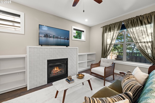 7886 SW Capitol Hill Rd, Portland, OR 97219 - living area with wood finished floors, ceiling fan, a fireplace, and recessed lighting