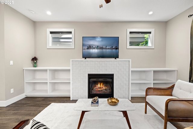 7886 SW Capitol Hill Rd, Portland, OR 97219 - living room featuring wood finished floors, a ceiling fan, a brick fireplace, and recessed lighting