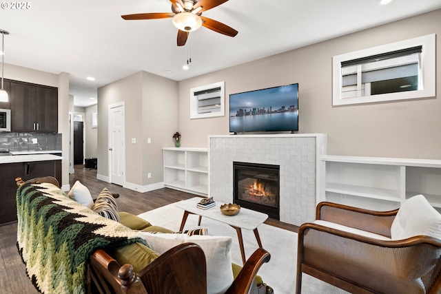 7886 SW Capitol Hill Rd, Portland, OR 97219 - living area featuring dark wood-type flooring, ceiling fan, recessed lighting, and a fireplace