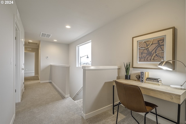 home office with light colored carpet