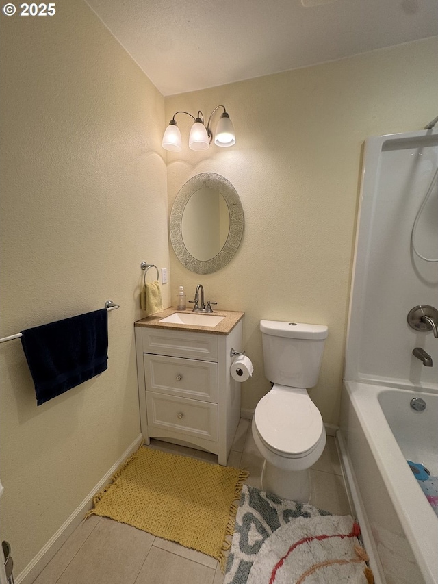 full bathroom featuring washtub / shower combination, vanity, toilet, tile patterned floors, and baseboards