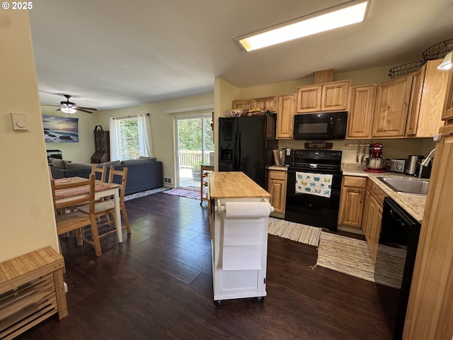 kitchen featuring light brown cabinets, wooden counters, open floor plan, dark wood-style floors, and black appliances