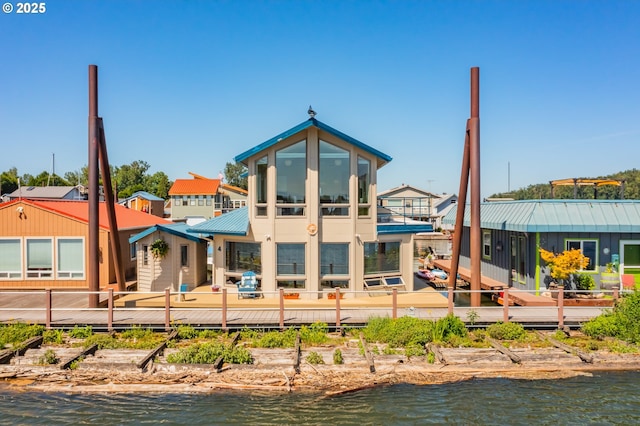 18989 NE Marine Dr Unit 04, Portland, OR 97230 - rear view of house with a water view and metal roof