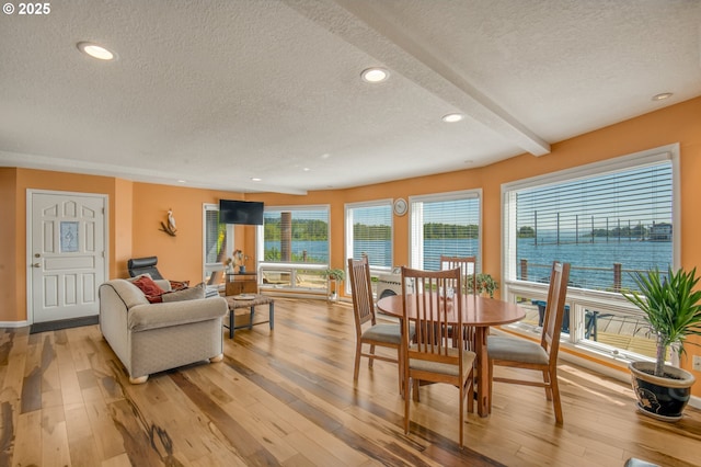 18989 NE Marine Dr Unit 04, Portland, OR 97230 - dining room with a textured ceiling, light wood-style floors, recessed lighting, and baseboards