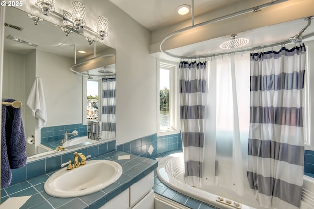 18989 NE Marine Dr Unit 04, Portland, OR 97230 - full bath with vanity and a combined bath / shower with jetted tub