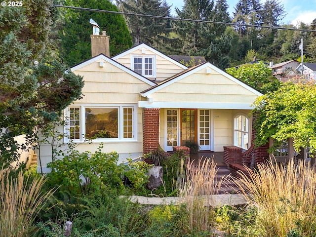 1925 Irving Ave, Astoria, OR 97103 - view of front facade featuring a chimney and a porch