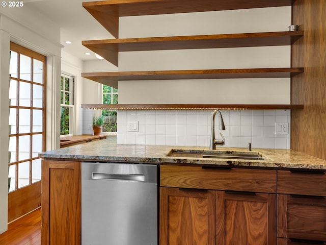 1925 Irving Ave, Astoria, OR 97103 - kitchen with open shelves, dishwasher, brown cabinetry, backsplash, and light stone counters