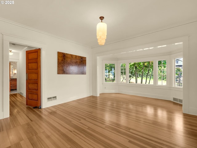 1925 Irving Ave, Astoria, OR 97103 - unfurnished room with light wood finished floors and crown molding