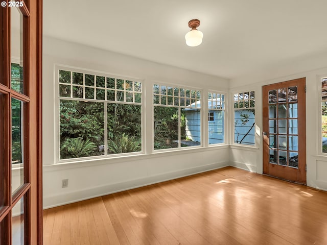 1925 Irving Ave, Astoria, OR 97103 - unfurnished sunroom with healthy amount of natural light and hardwood / wood-style flooring