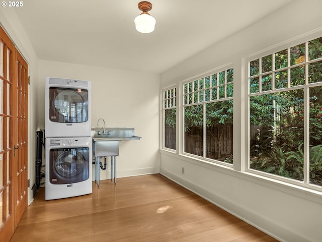 1925 Irving Ave, Astoria, OR 97103 - laundry room featuring stacked washer / dryer and light wood-style flooring