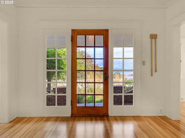 1925 Irving Ave, Astoria, OR 97103 - entryway with wood finished floors, healthy amount of natural light, and ornamental molding