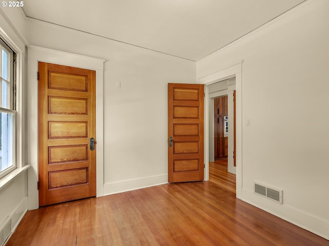 1925 Irving Ave, Astoria, OR 97103 - empty room with light wood finished floors and plenty of natural light