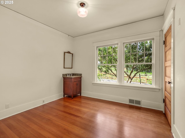 1925 Irving Ave, Astoria, OR 97103 - spare room featuring wood finished floors and baseboards