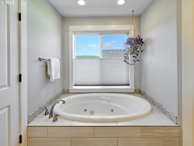 bathroom featuring a whirlpool tub and recessed lighting