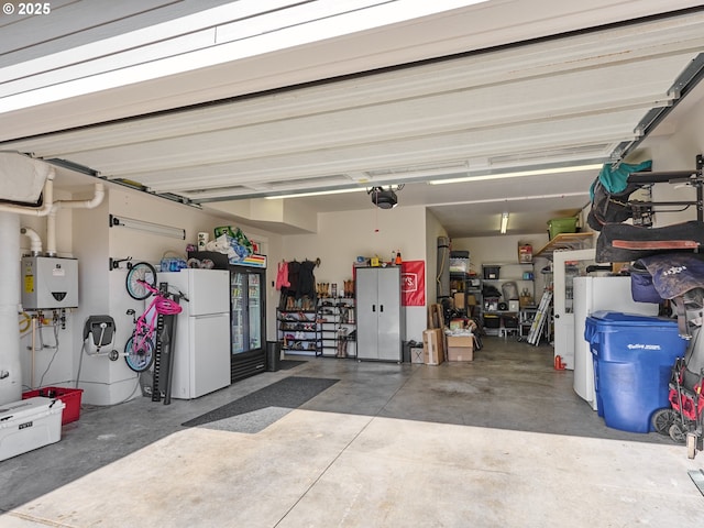 garage with freestanding refrigerator, a garage door opener, and water heater