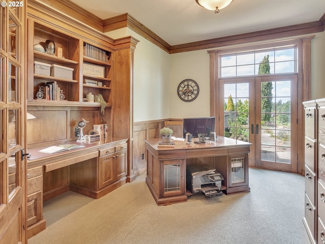 office area featuring french doors, light colored carpet, and crown molding