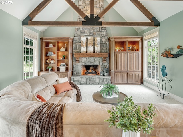 living room featuring carpet floors, vaulted ceiling with beams, and a fireplace