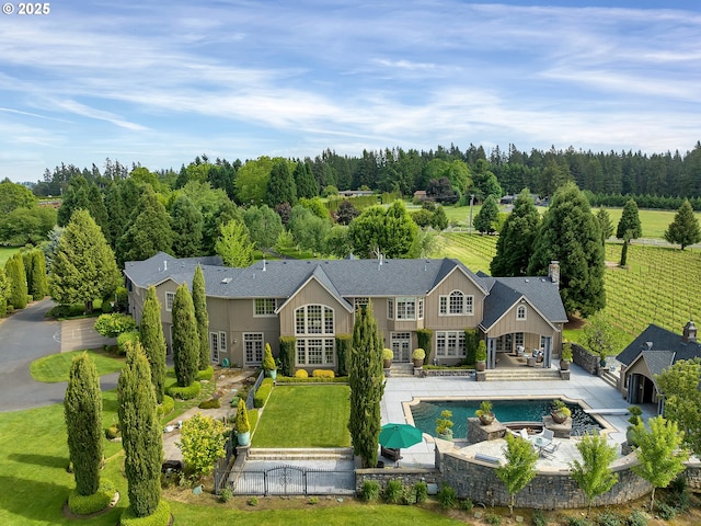 back of property with a patio