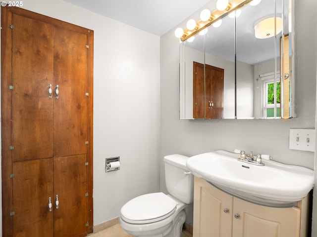 3128 SE 64th Ave, Portland, OR 97206 - bathroom featuring toilet, vanity, and baseboards